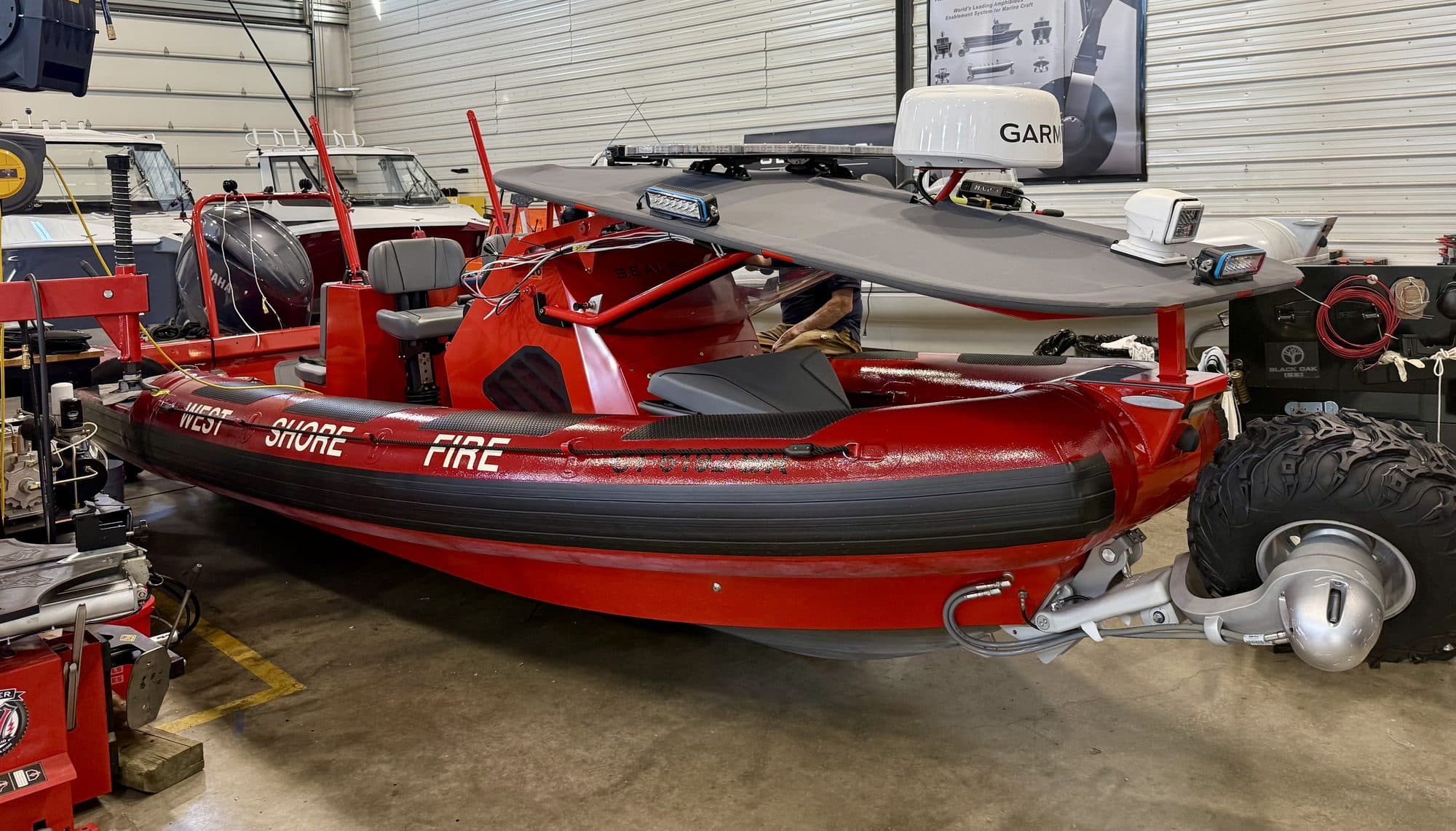 A red fire and rescue Sealegs RIB inside the Bristol workshop