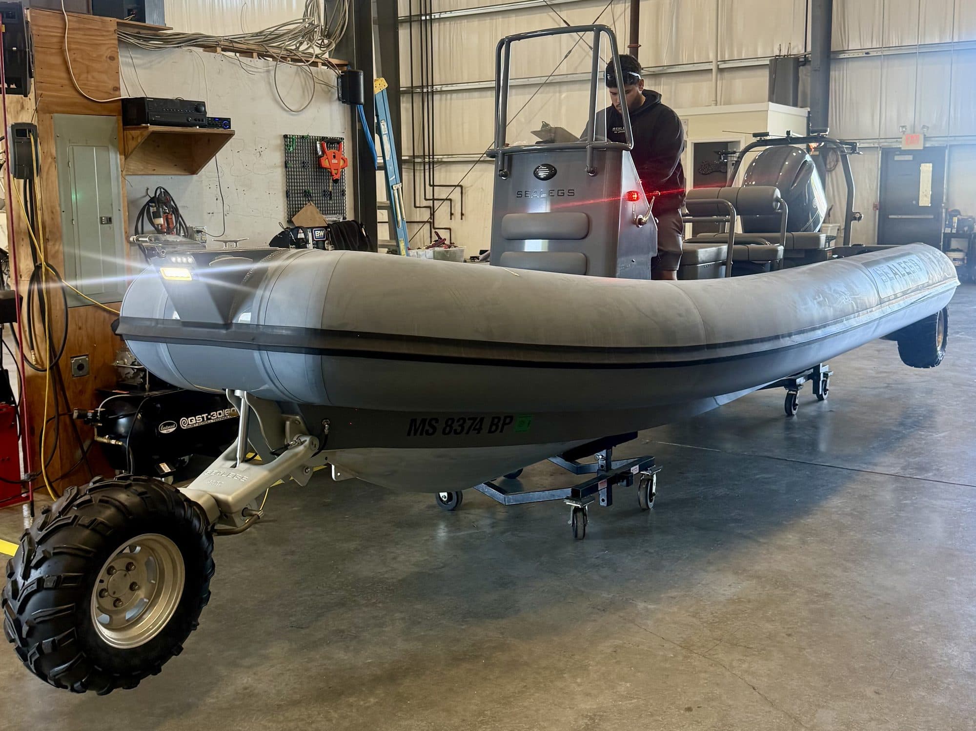 A Sealegs RIB raised on its wheels on the Bristol workshop floor